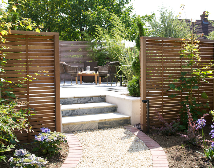 Create a secluded dining area with slatted panels
